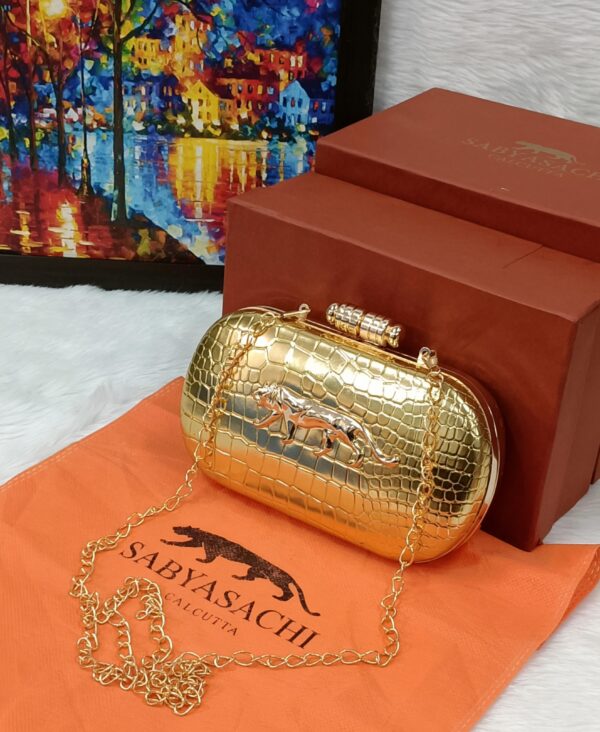 Sayasachi Clutch GOLDEN with a crocodile texture.